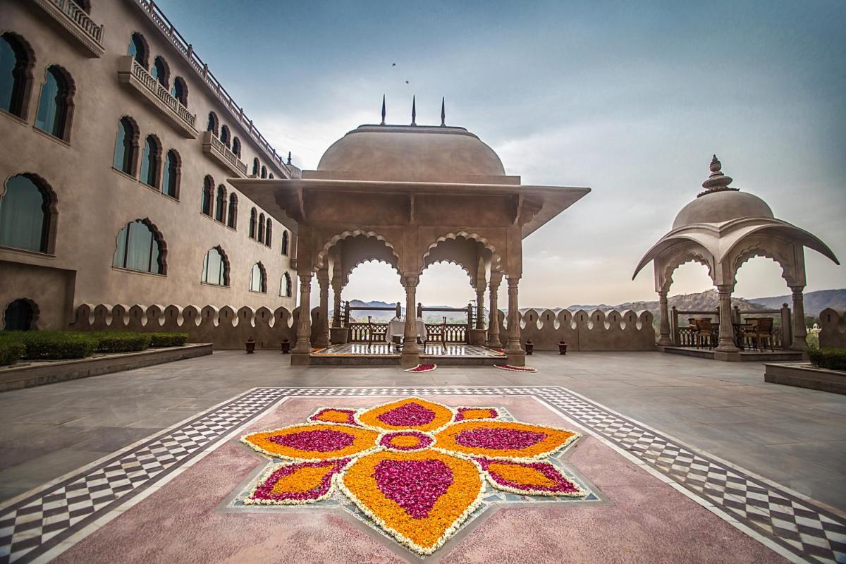 a large building with a flower painted on the floor at Fairmont Jaipur in Jaipur