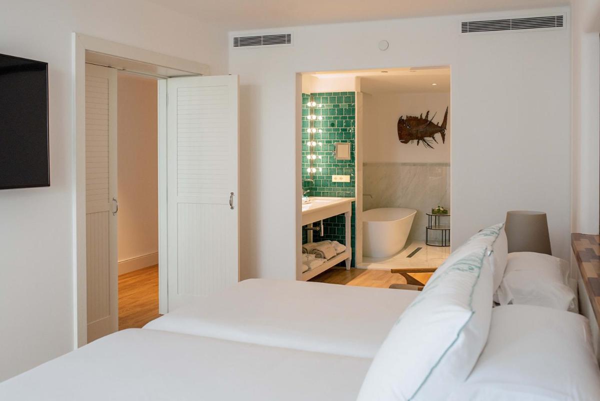 Cama o camas de una habitación en Hotel Fariones