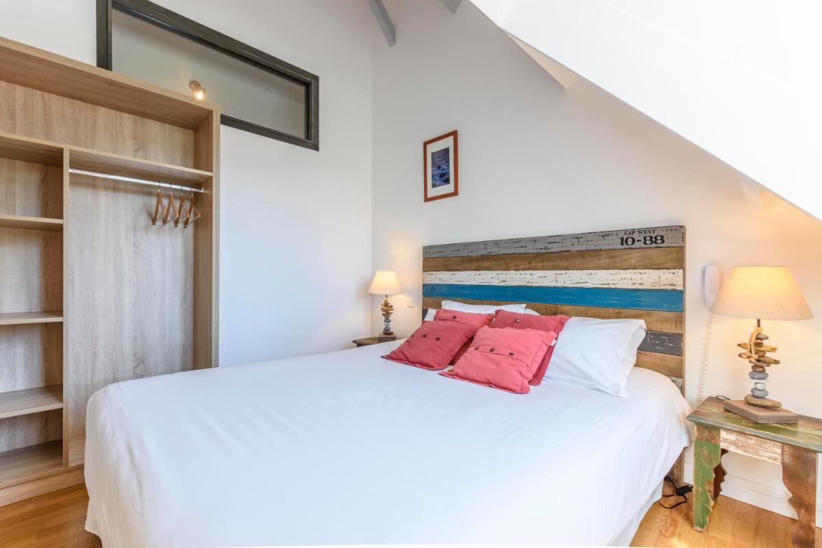 Un ou plusieurs lits dans un hébergement de l'établissement La Désirade - Hôtel, Spa & Restaurant