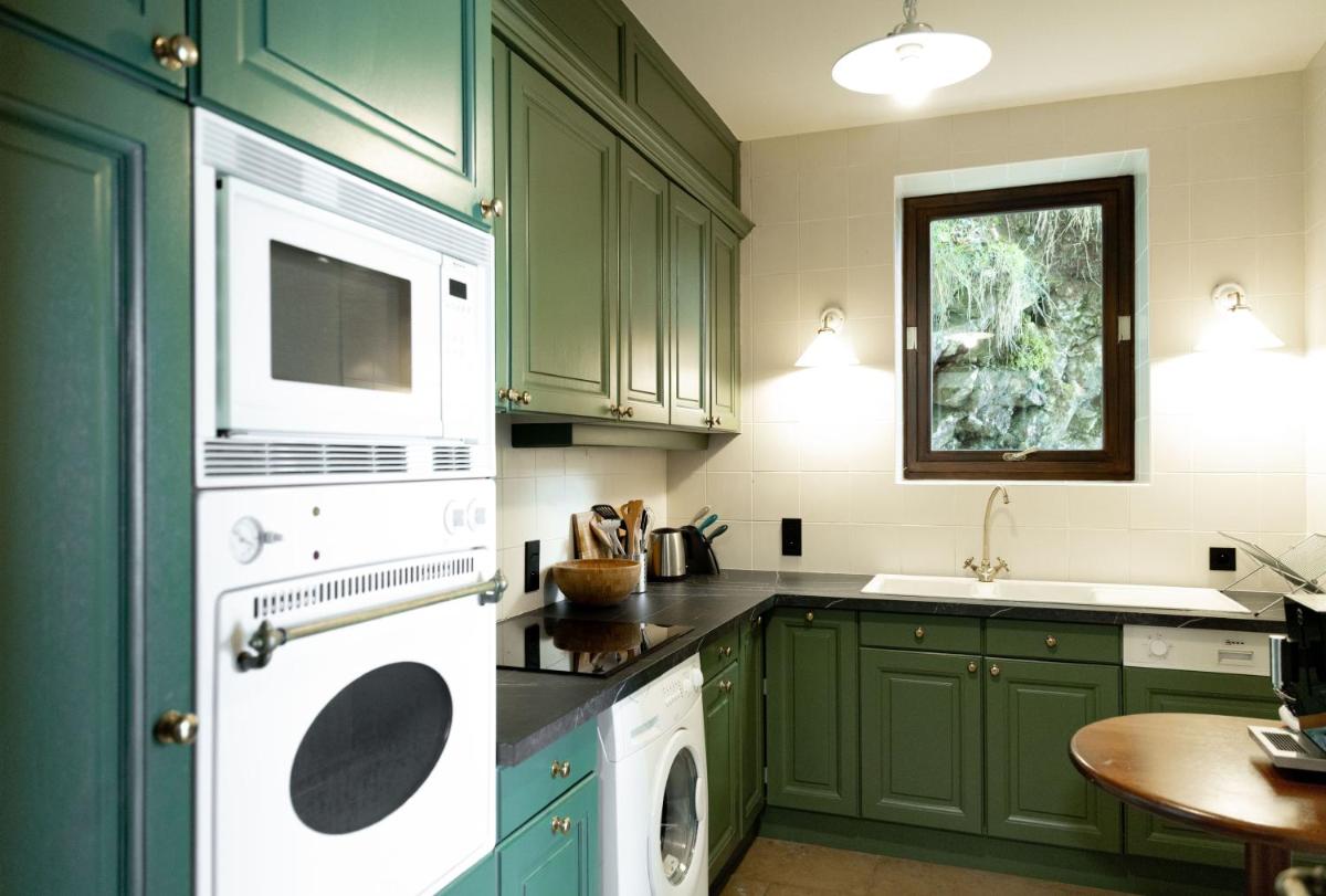 Cuisine ou kitchenette dans l'établissement Le Palace De Menthon