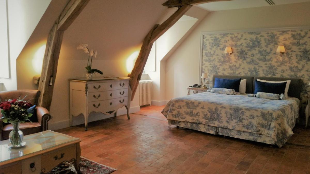 Un ou plusieurs lits dans un hébergement de l'établissement Château de Vault de Lugny