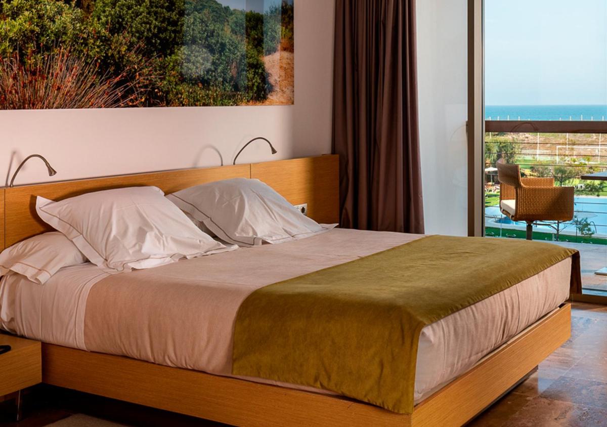 Cama o camas de una habitación en Parador de El Saler