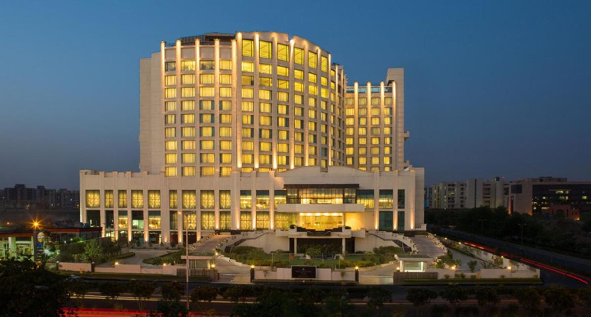 a large building with lights on in front of it at Welcomhotel by ITC Hotels, Dwarka, New Delhi in New Delhi a large building with lights on in front of it at Welcomhotel by ITC Hotels, Dwarka, New Delhi in New Delhi