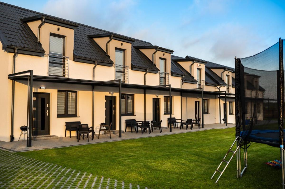 Spokojne Miejsce - domki - apartamenty nad morzem - Housity