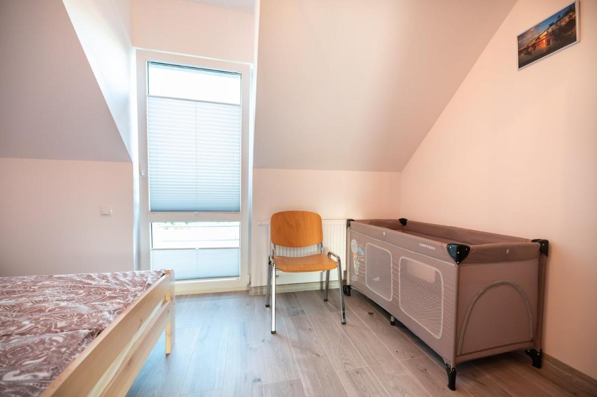 Spokojne Miejsce - domki - apartamenty nad morzem - Housity