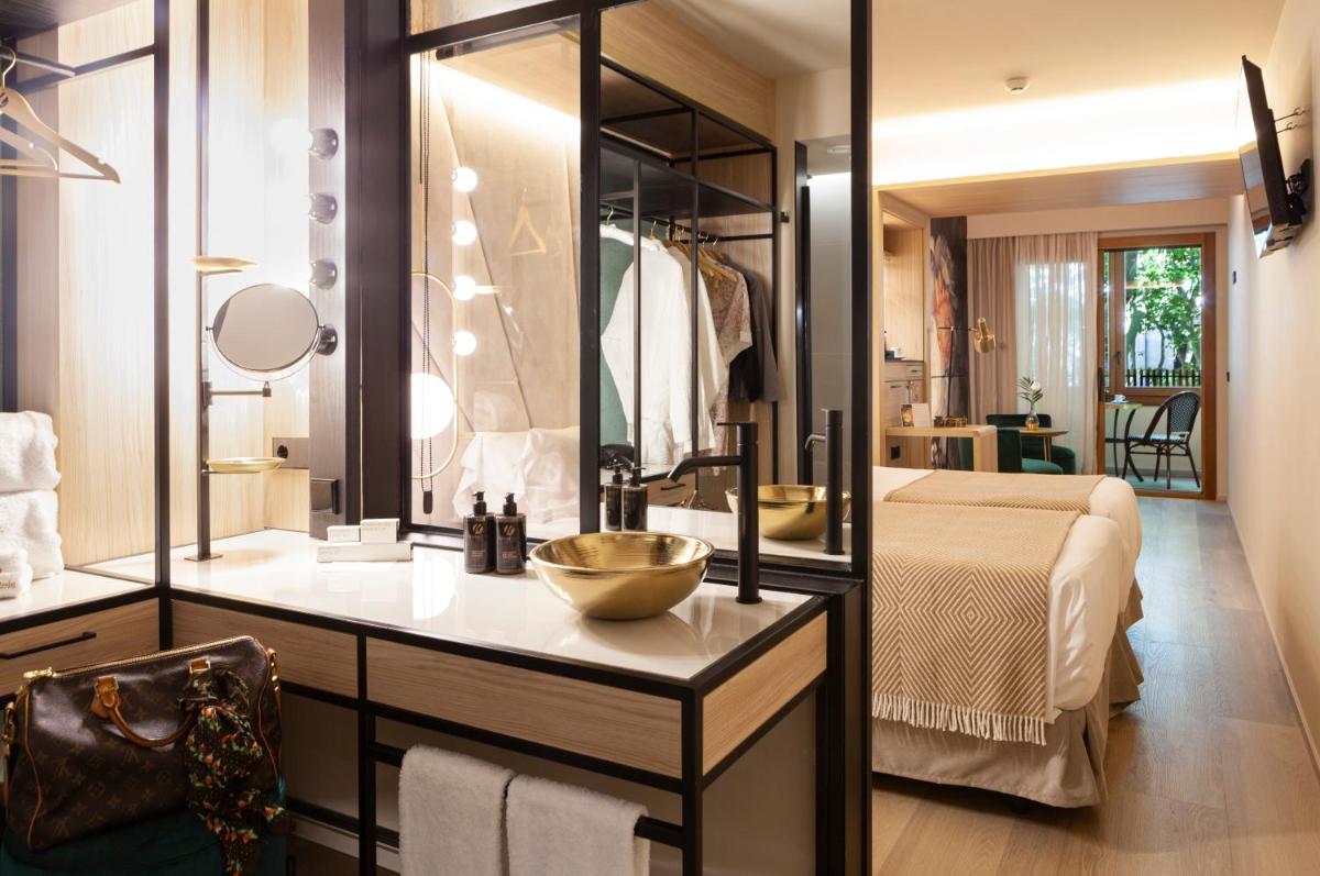 Cama o camas de una habitación en Nivia Born Boutique Hotel