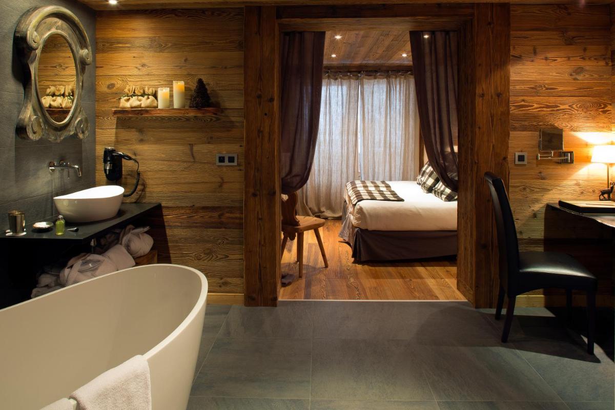 Un ou plusieurs lits dans un hébergement de l'établissement Chalet-Hôtel Hermitage