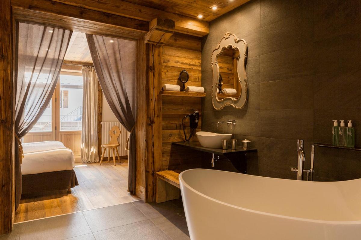 Un ou plusieurs lits dans un hébergement de l'établissement Chalet-Hôtel Hermitage