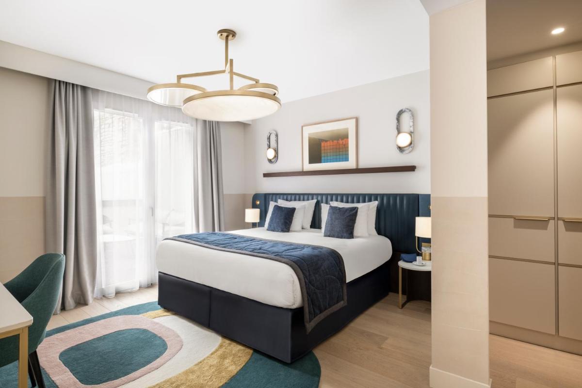 Un ou plusieurs lits dans un hébergement de l'établissement Maison Albar Hotels L’Imperator