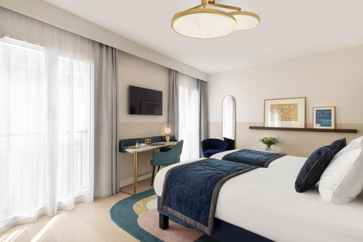 Un ou plusieurs lits dans un hébergement de l'établissement Maison Albar Hotels L’Imperator