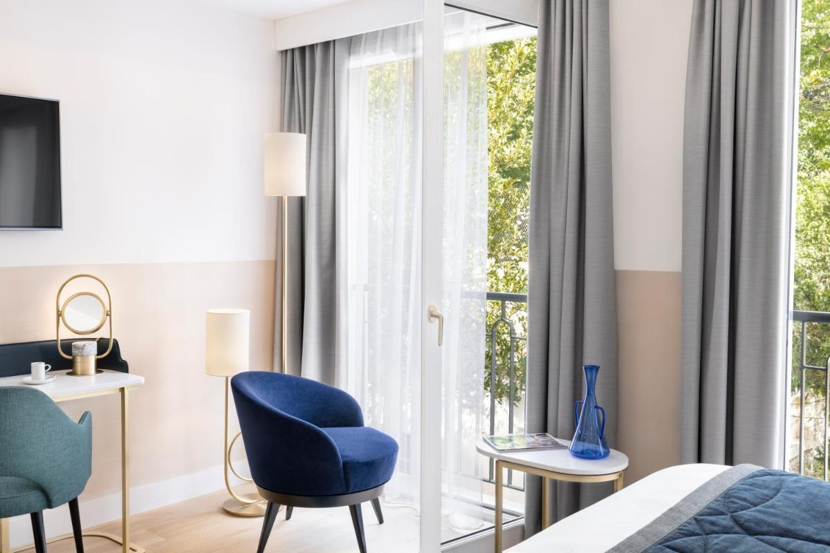 Un ou plusieurs lits dans un hébergement de l'établissement Maison Albar Hotels L’Imperator