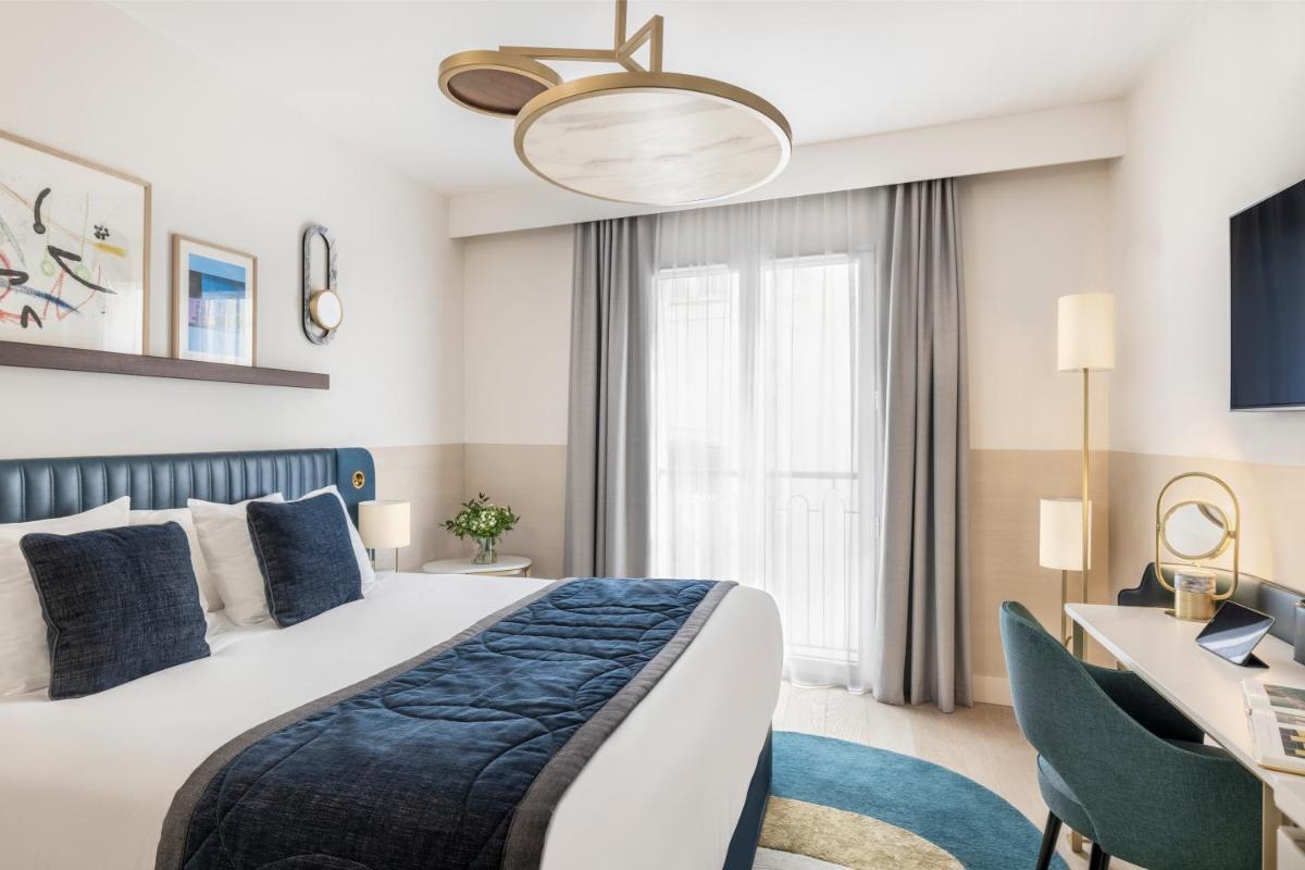 Un ou plusieurs lits dans un hébergement de l'établissement Maison Albar Hotels L’Imperator