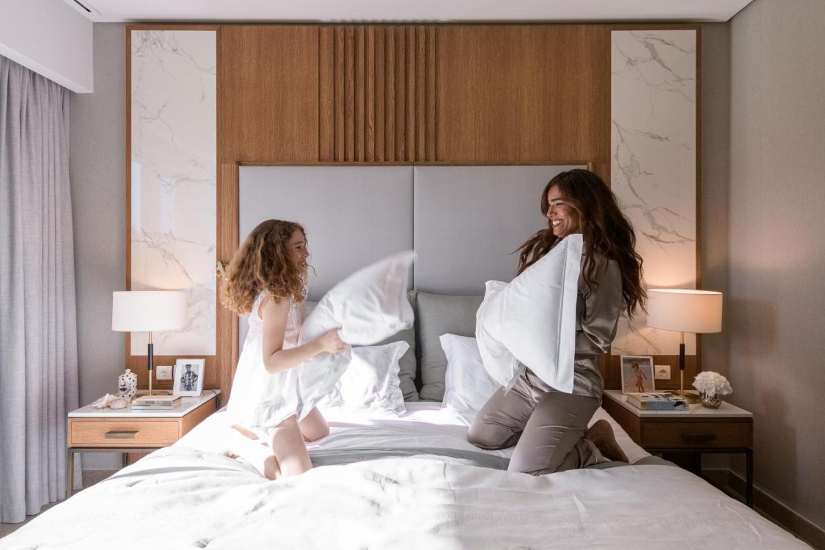 Uma cama ou camas num quarto em Wyndham Grand Algarve