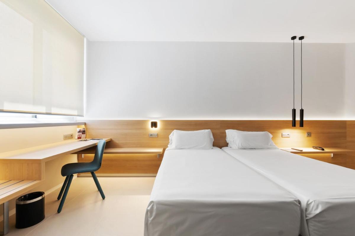 Cama o camas de una habitación en Hotel Areca