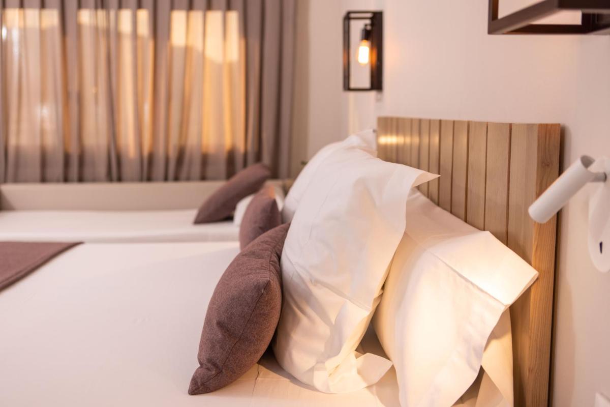 Cama o camas de una habitación en RVHotels Broquetas Spa Termal