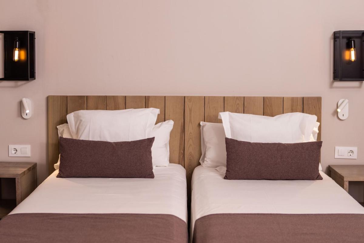 Cama o camas de una habitación en RVHotels Broquetas Spa Termal
