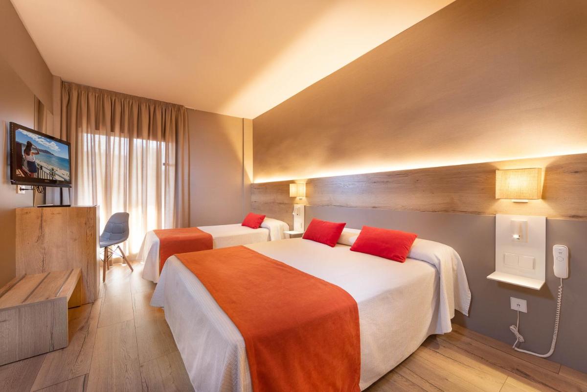 Cama o camas de una habitación en Hotel Montecarlo Spa & Wellness