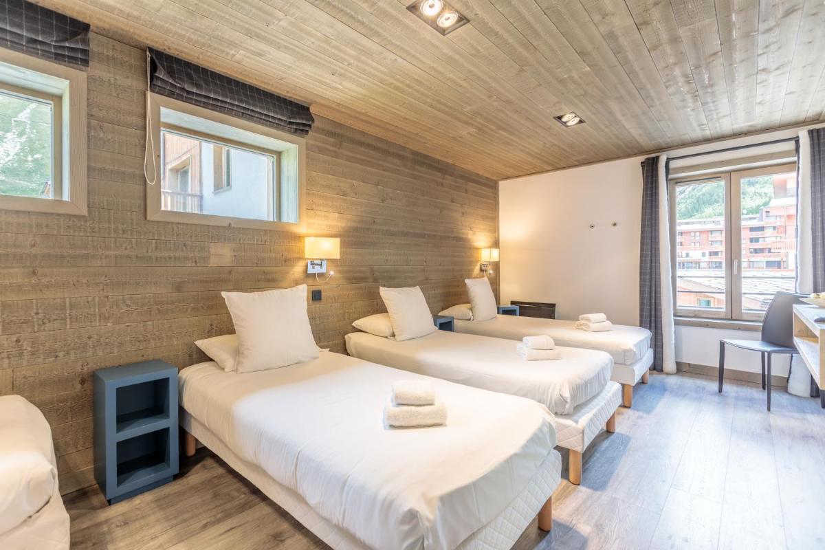 Un ou plusieurs lits dans un hébergement de l'établissement Victoria Lodge, Friendly Hotel
