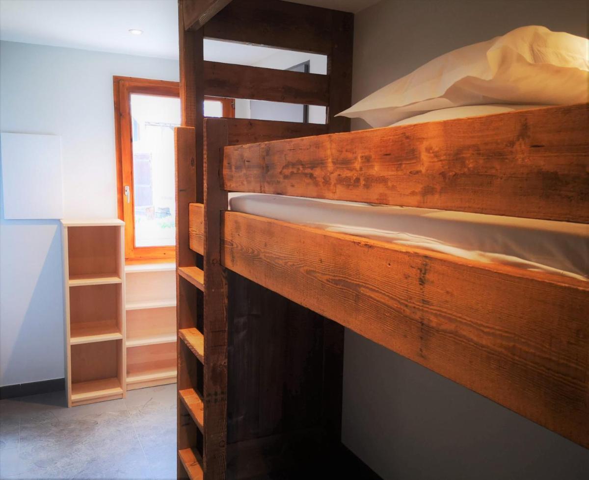 Un ou plusieurs lits superposés dans un hébergement de l'établissement Alliey & Spa Piscine Appart-hôtel Serre chevalier