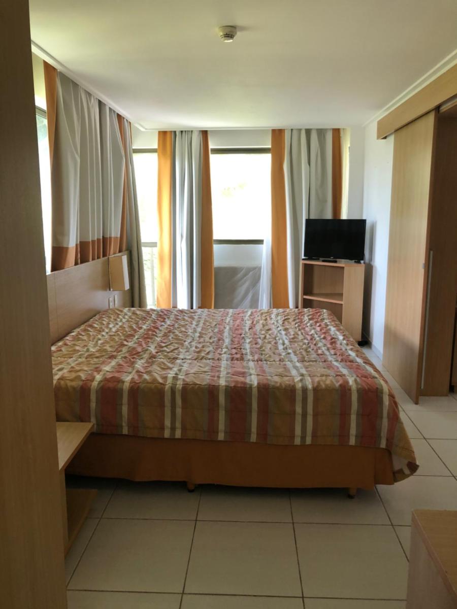 Flat no Beach Class Muro Alto - Housity