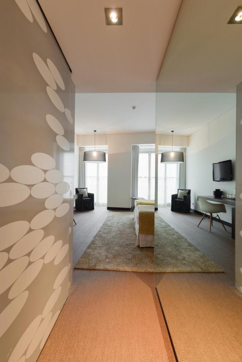 Uma televisão e/ou sistema de entretenimento em Inspira Liberdade Boutique Hotel