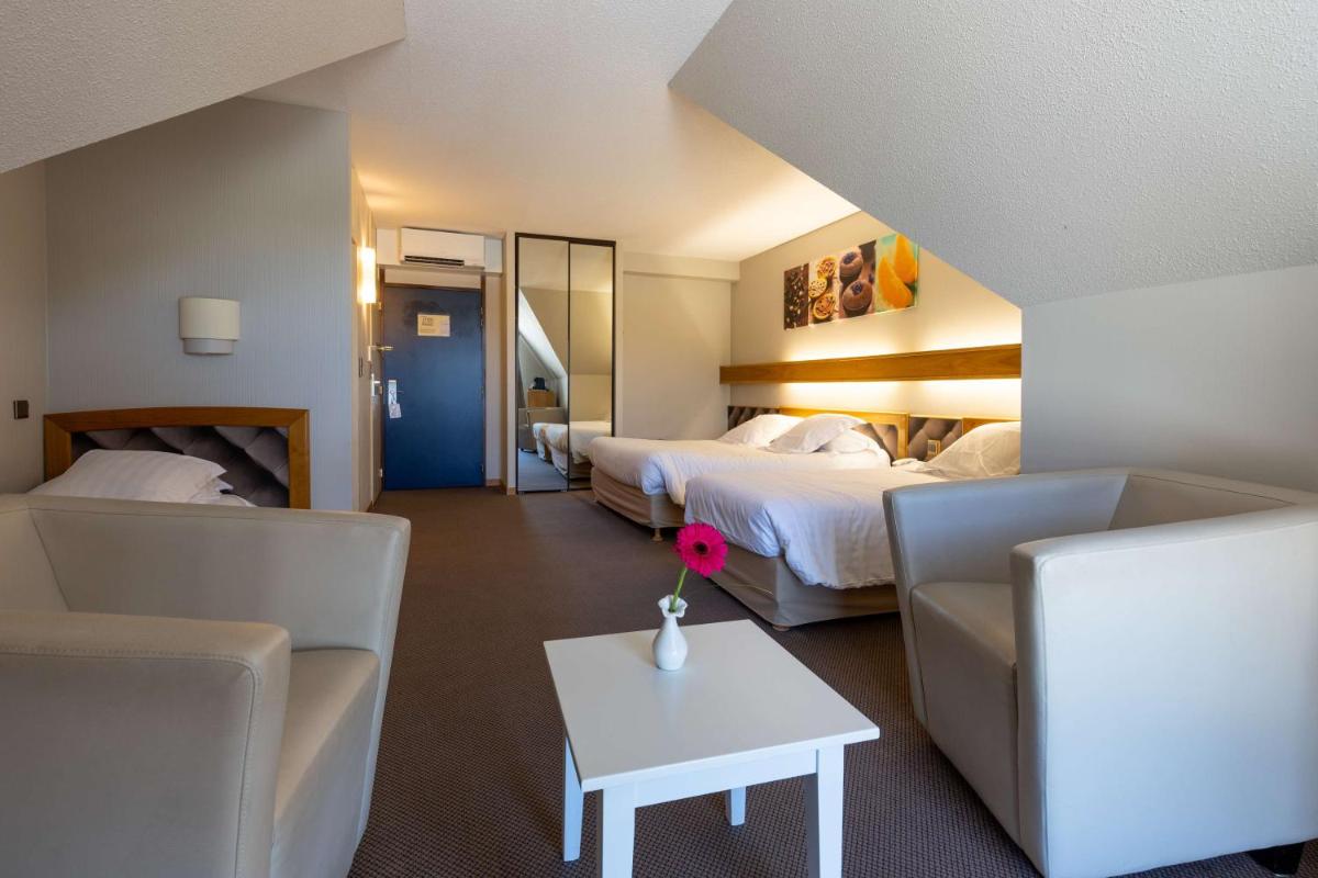 Un ou plusieurs lits dans un hébergement de l'établissement Best Western Le Relais de Laguiole Hôtel & Spa