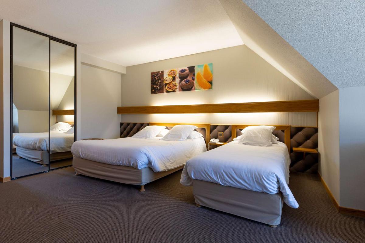 Un ou plusieurs lits dans un hébergement de l'établissement Best Western Le Relais de Laguiole Hôtel & Spa