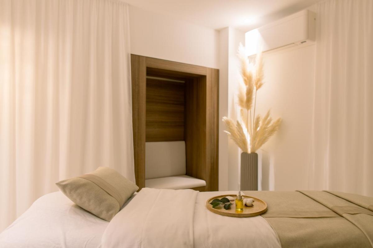 Un ou plusieurs lits dans un hébergement de l'établissement Hôtel Marinca & Spa
