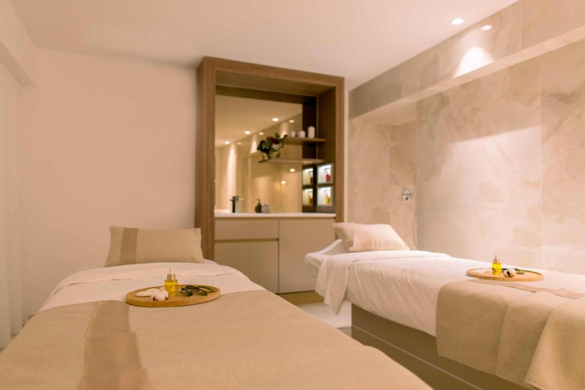 Un ou plusieurs lits dans un hébergement de l'établissement Hôtel Marinca & Spa