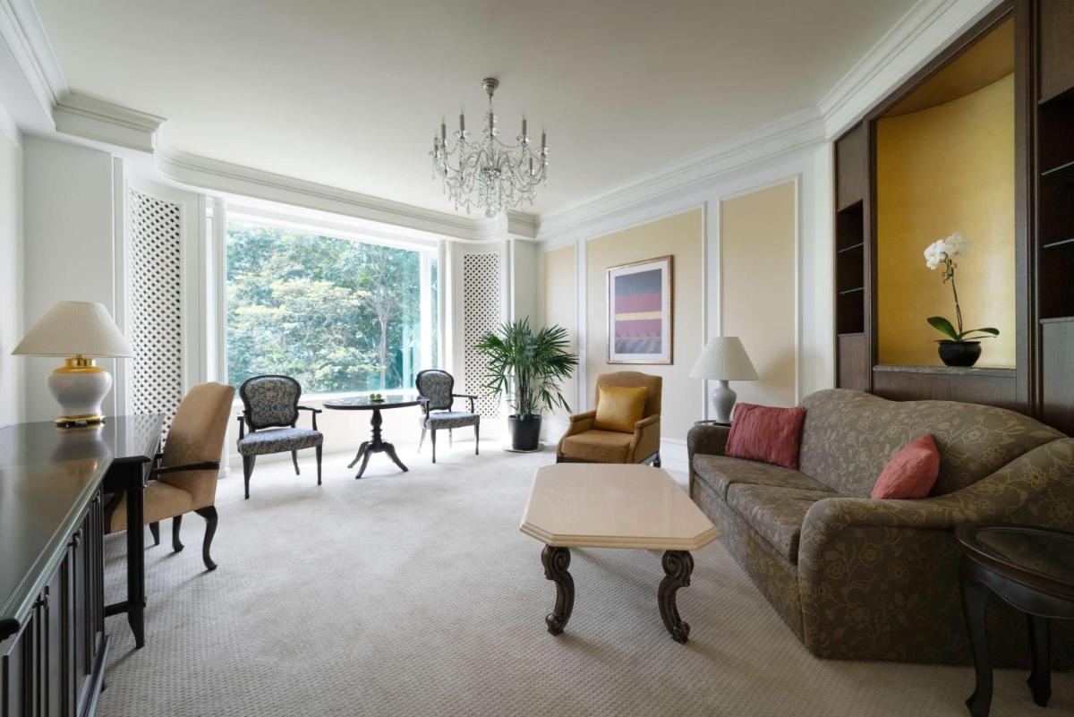 a living room with a couch and a table at Shangri-La Singapore in Singapore
