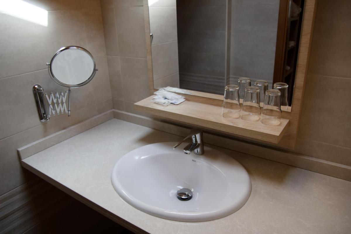 Un baño de Hotel Rural Las Montañas de Pumar