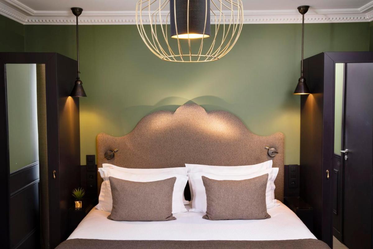 Un ou plusieurs lits dans un hébergement de l'établissement Hotel Monsieur & Spa