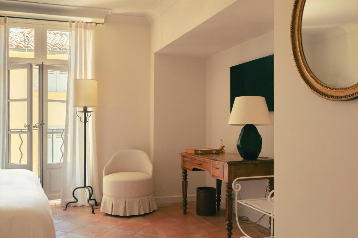 Un ou plusieurs lits dans un hébergement de l'établissement Hotel la Ponche