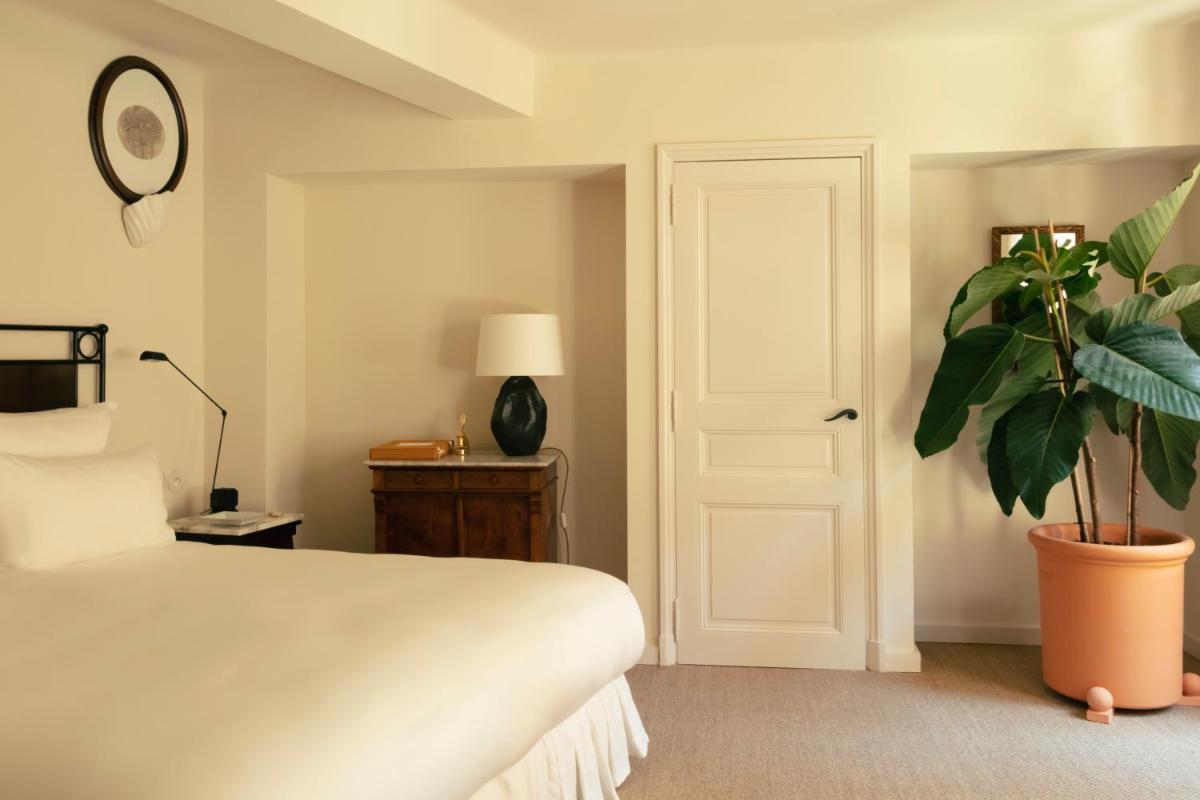 Un ou plusieurs lits dans un hébergement de l'établissement Hotel la Ponche