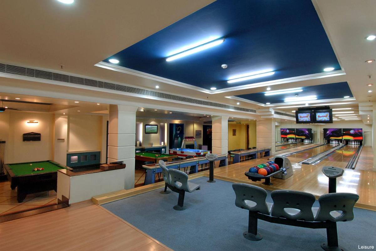 a room with a bowling alley with pins and balls at Jaypee Palace Hotel in Agra