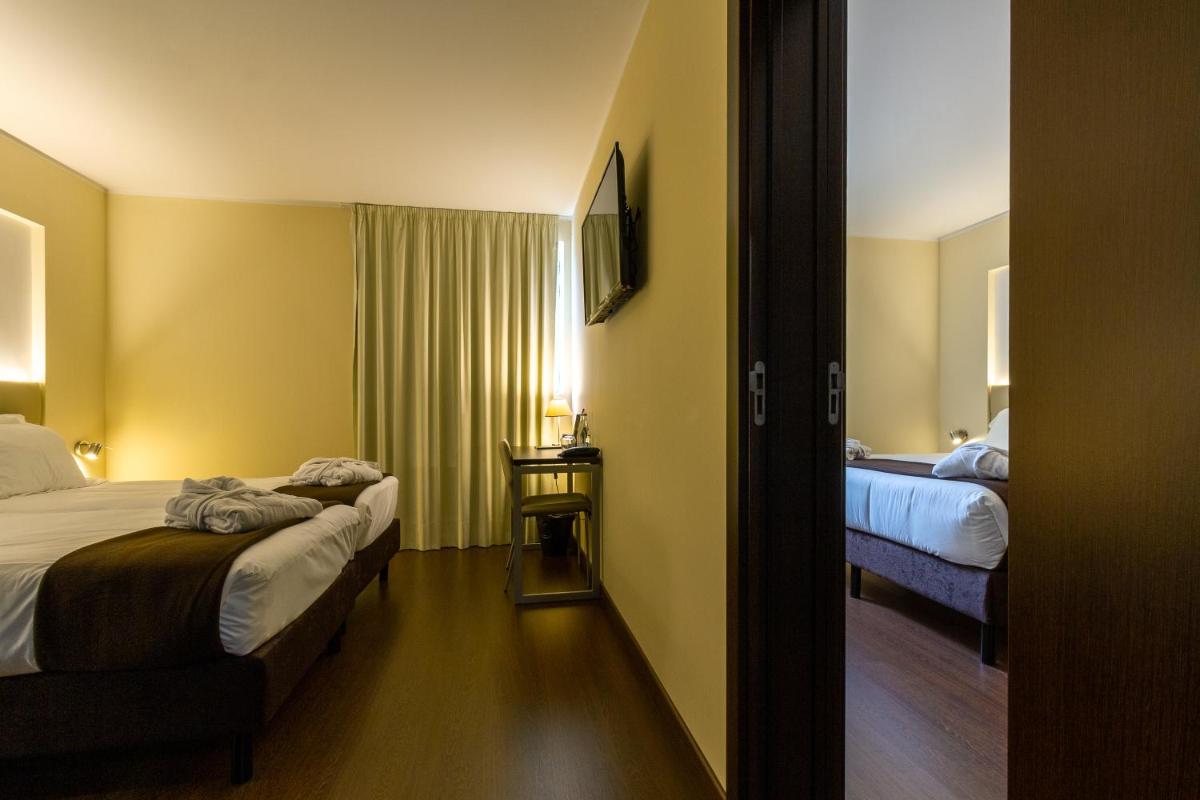 Uma cama ou camas num quarto em In Gold Hotel & Spa