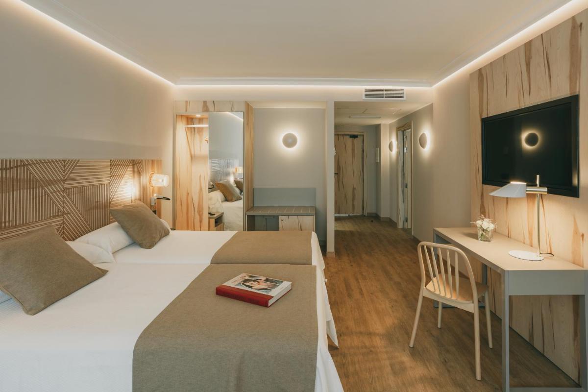 Cama o camas de una habitación en Hotel El Mirador
