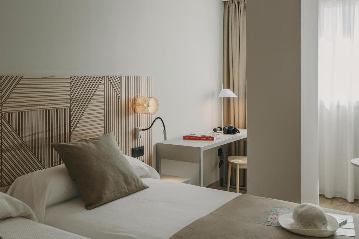 Cama o camas de una habitación en Hotel El Mirador