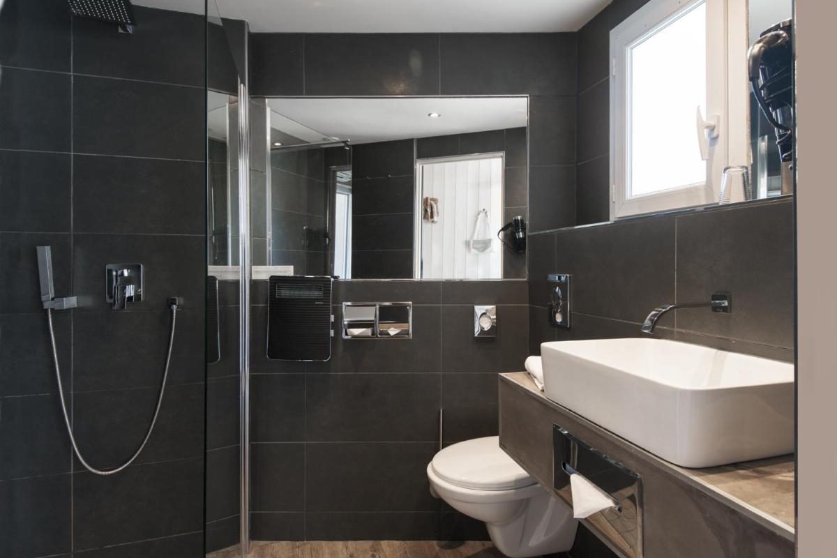 Salle de bains dans l'établissement Hôtel Restaurant & Spa Plaisir