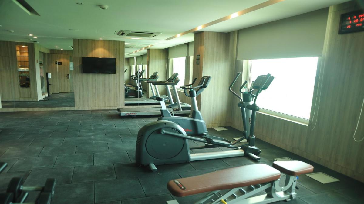 a gym with cardio equipment in a hotel room at Holiday Inn Gurugram Sector 90 by IHG in Gurgaon