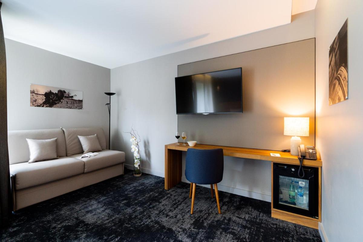 Télévision ou salle de divertissement dans l'établissement Fac & Spera -Hôtel & Spa