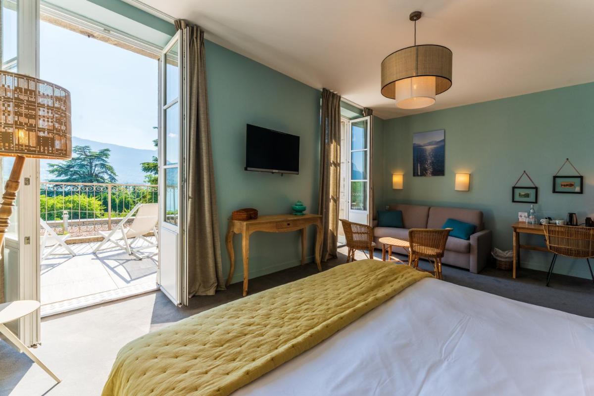 Un ou plusieurs lits dans un hébergement de l'établissement Hôtel Beau Site Talloires B SPA