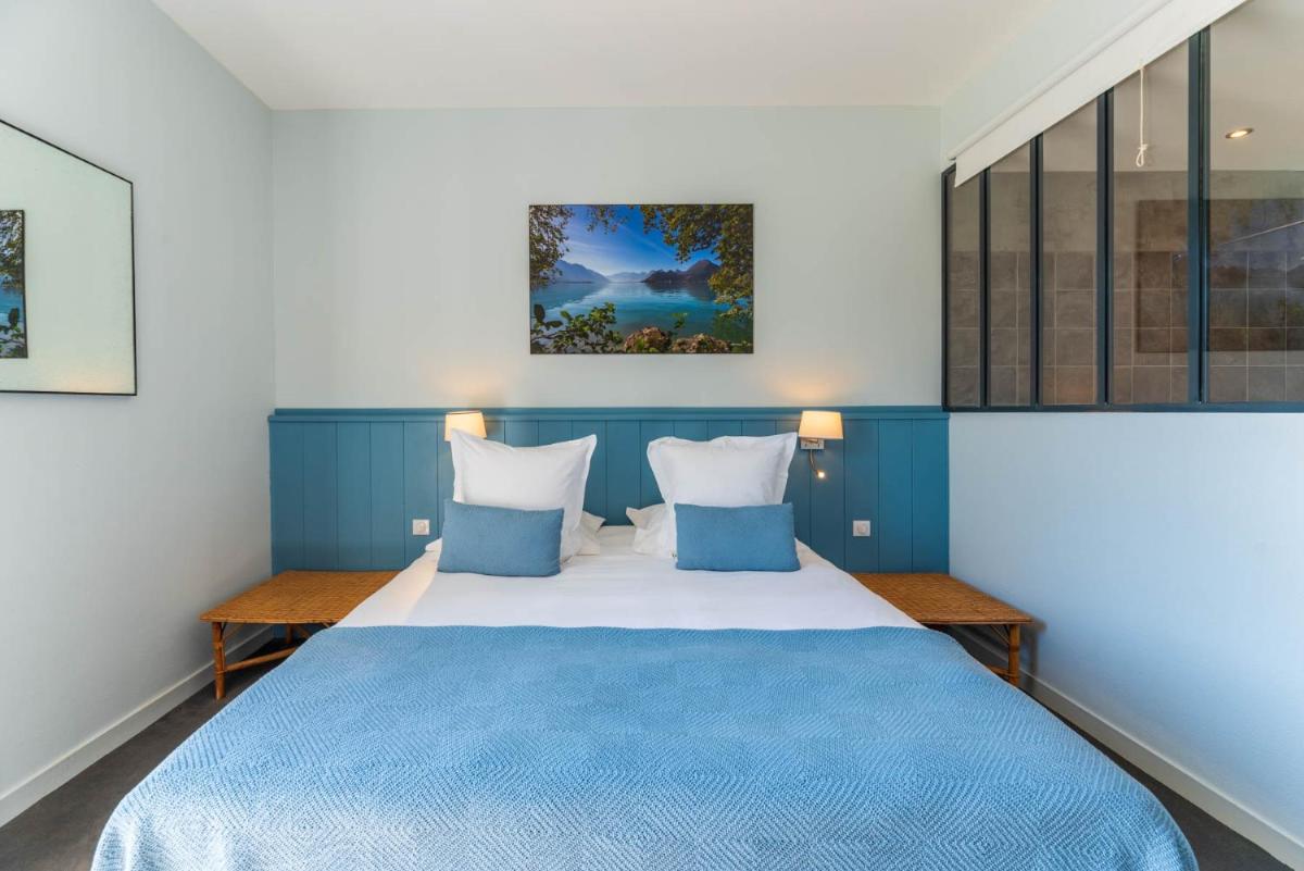 Un ou plusieurs lits dans un hébergement de l'établissement Hôtel Beau Site Talloires B SPA