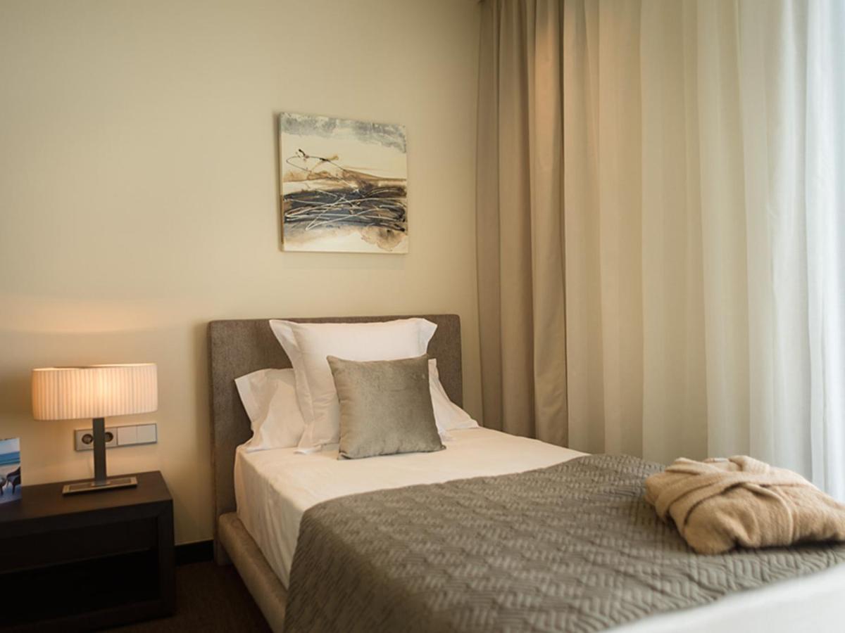 Cama o camas de una habitación en Cosmopolita Hotel Boutique & Spa