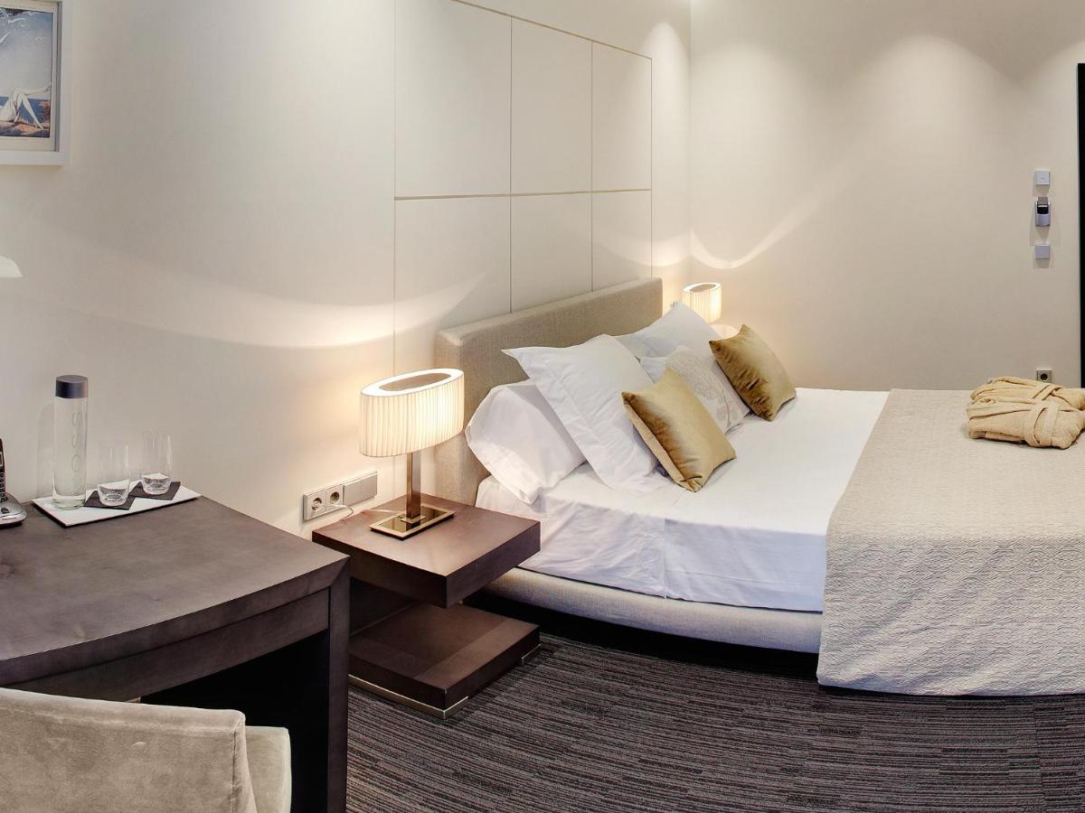 Cama o camas de una habitación en Cosmopolita Hotel Boutique & Spa