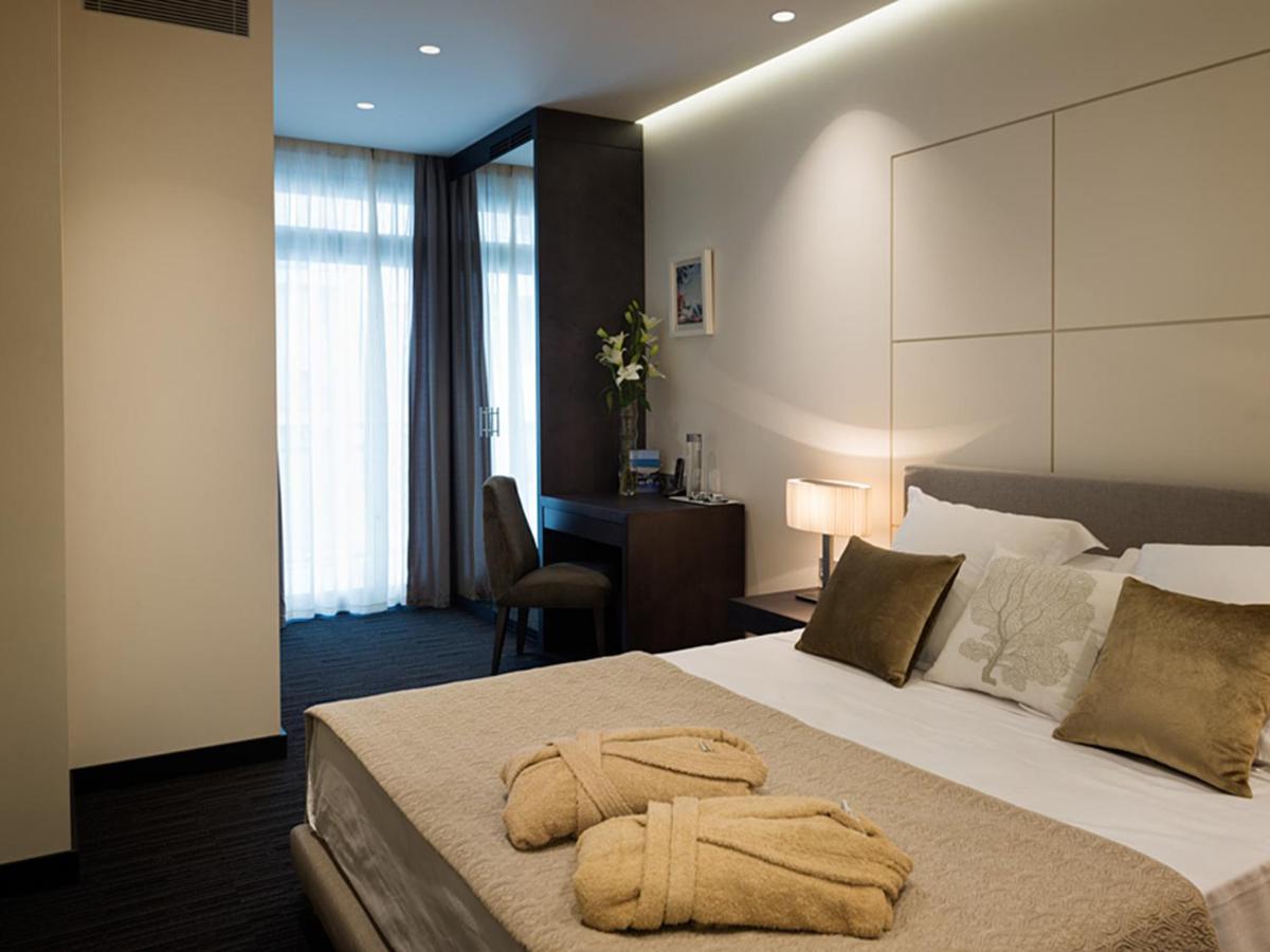 Cama o camas de una habitación en Cosmopolita Hotel Boutique & Spa