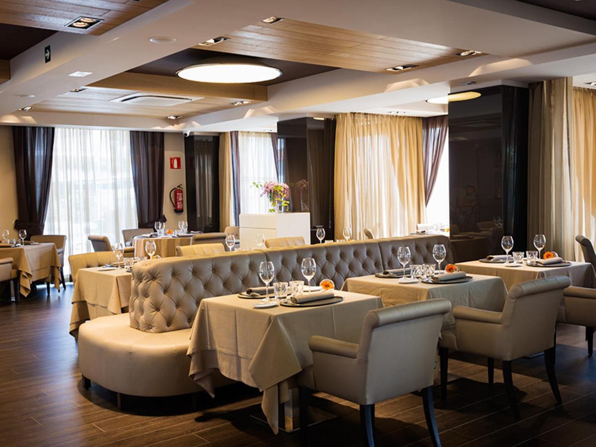 Un restaurante o sitio para comer en Cosmopolita Hotel Boutique & Spa