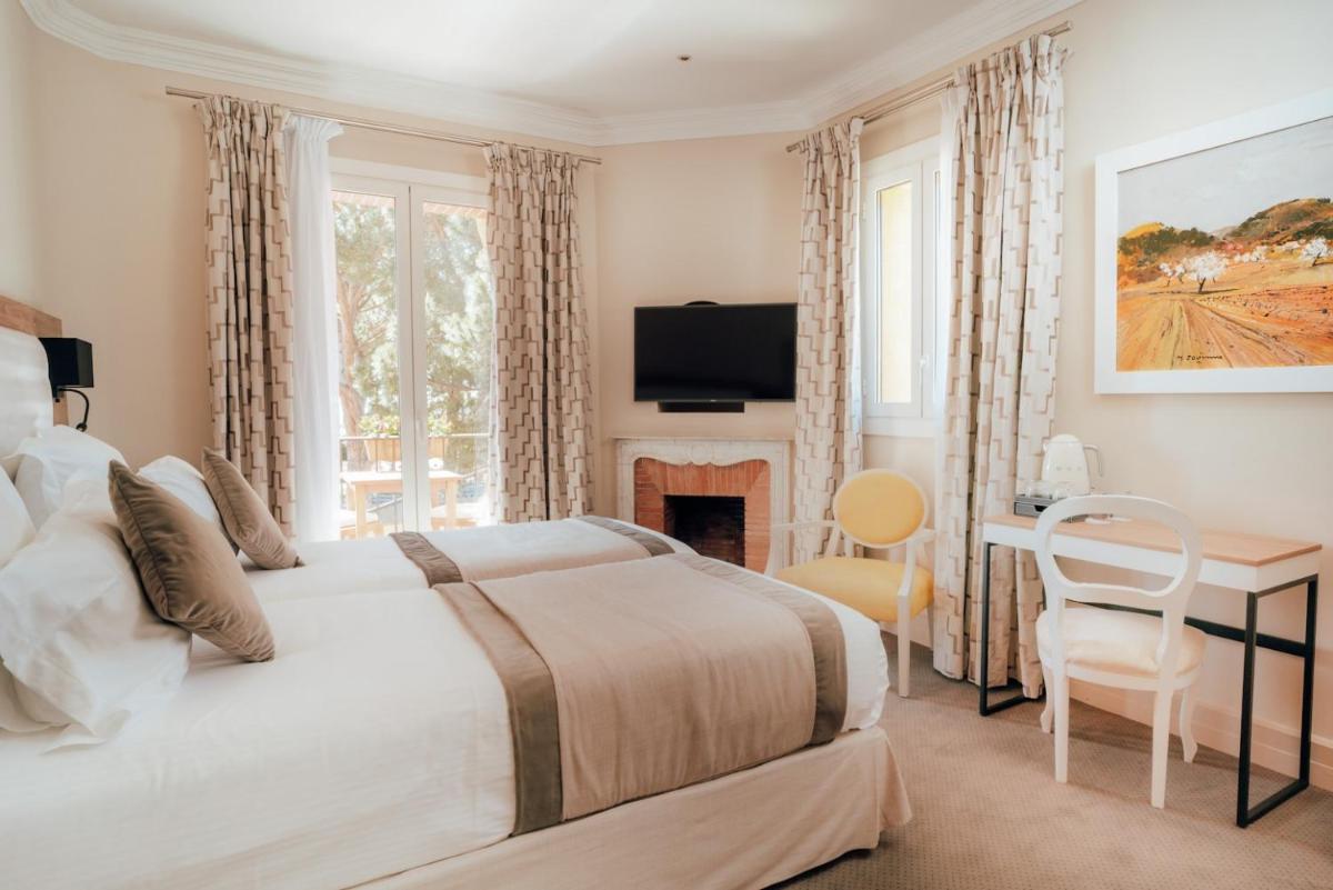 Un ou plusieurs lits dans un hébergement de l'établissement Ermitage de l'Oasis & Spa - Cannes Mandelieu
