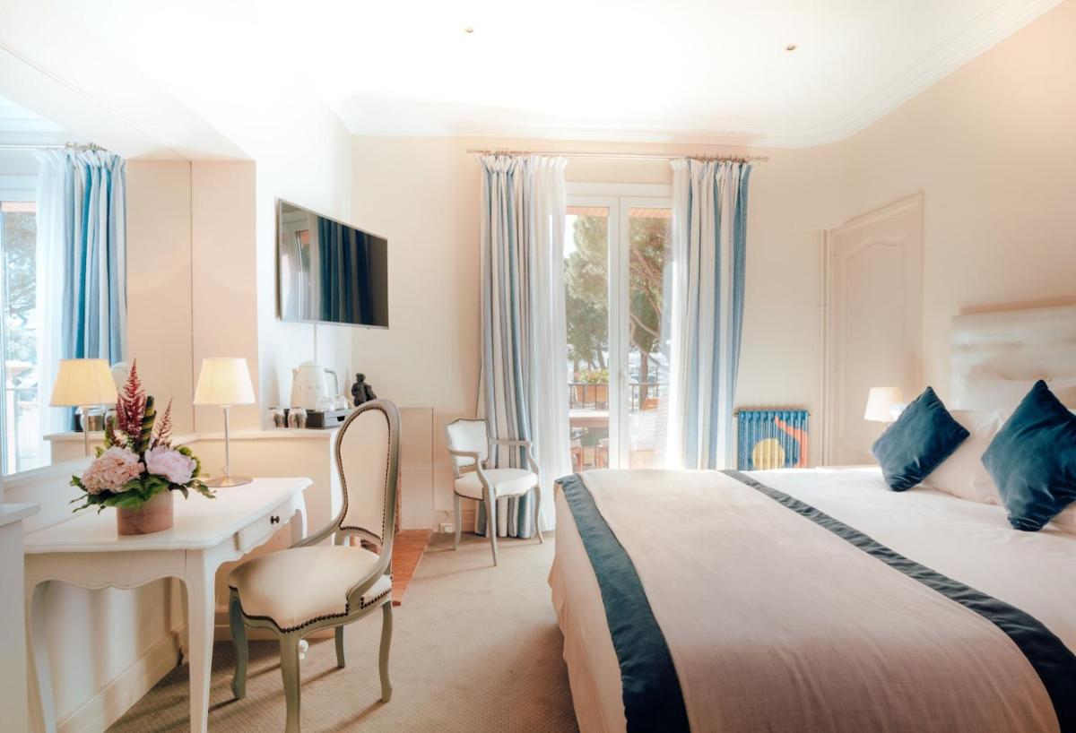 Un ou plusieurs lits dans un hébergement de l'établissement Ermitage de l'Oasis & Spa - Cannes Mandelieu