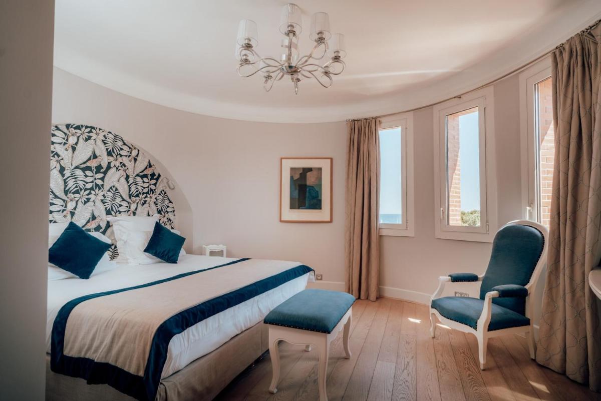Un ou plusieurs lits dans un hébergement de l'établissement Ermitage de l'Oasis & Spa - Cannes Mandelieu
